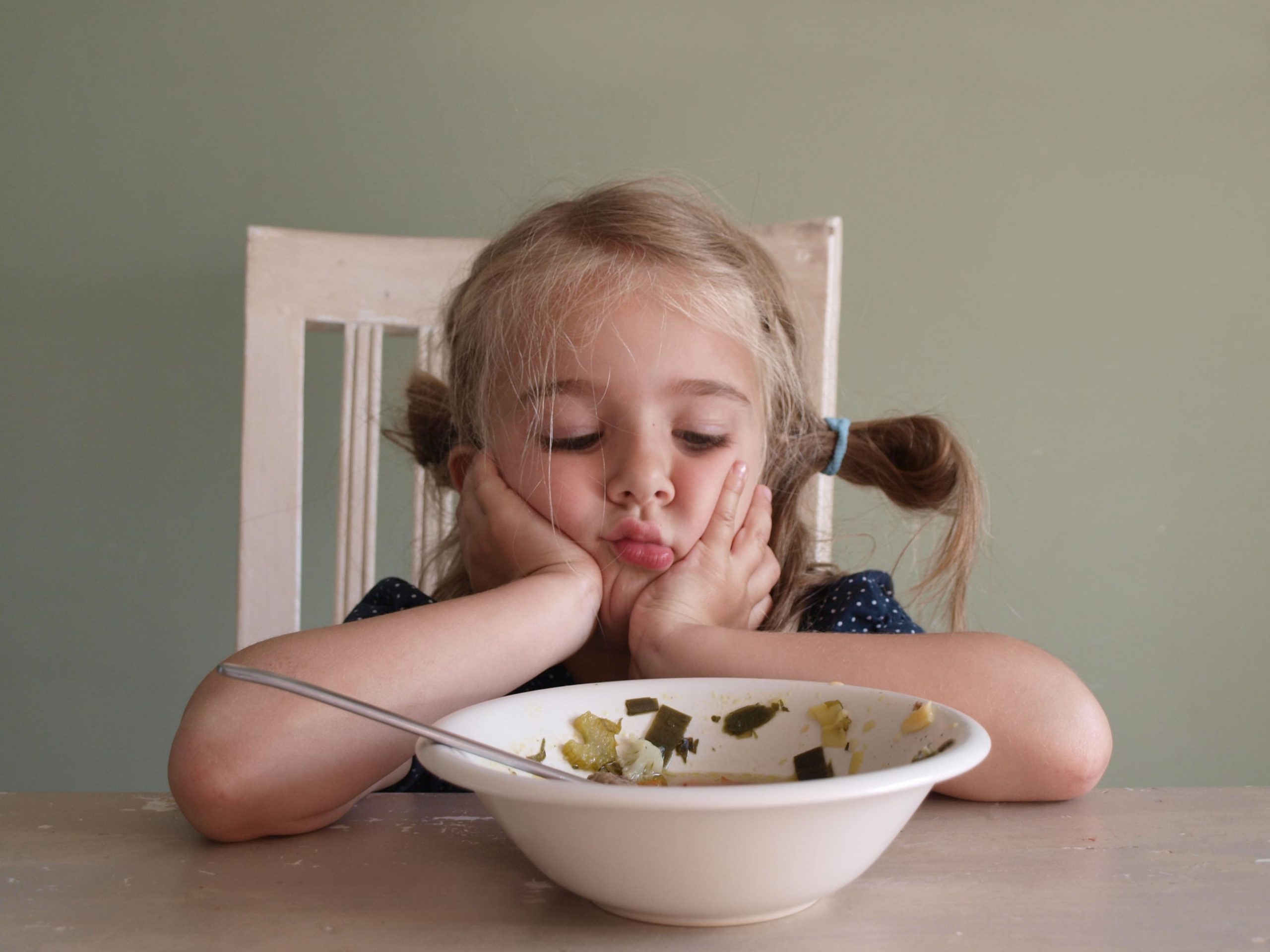 Child Looking Upset About eating vegetables